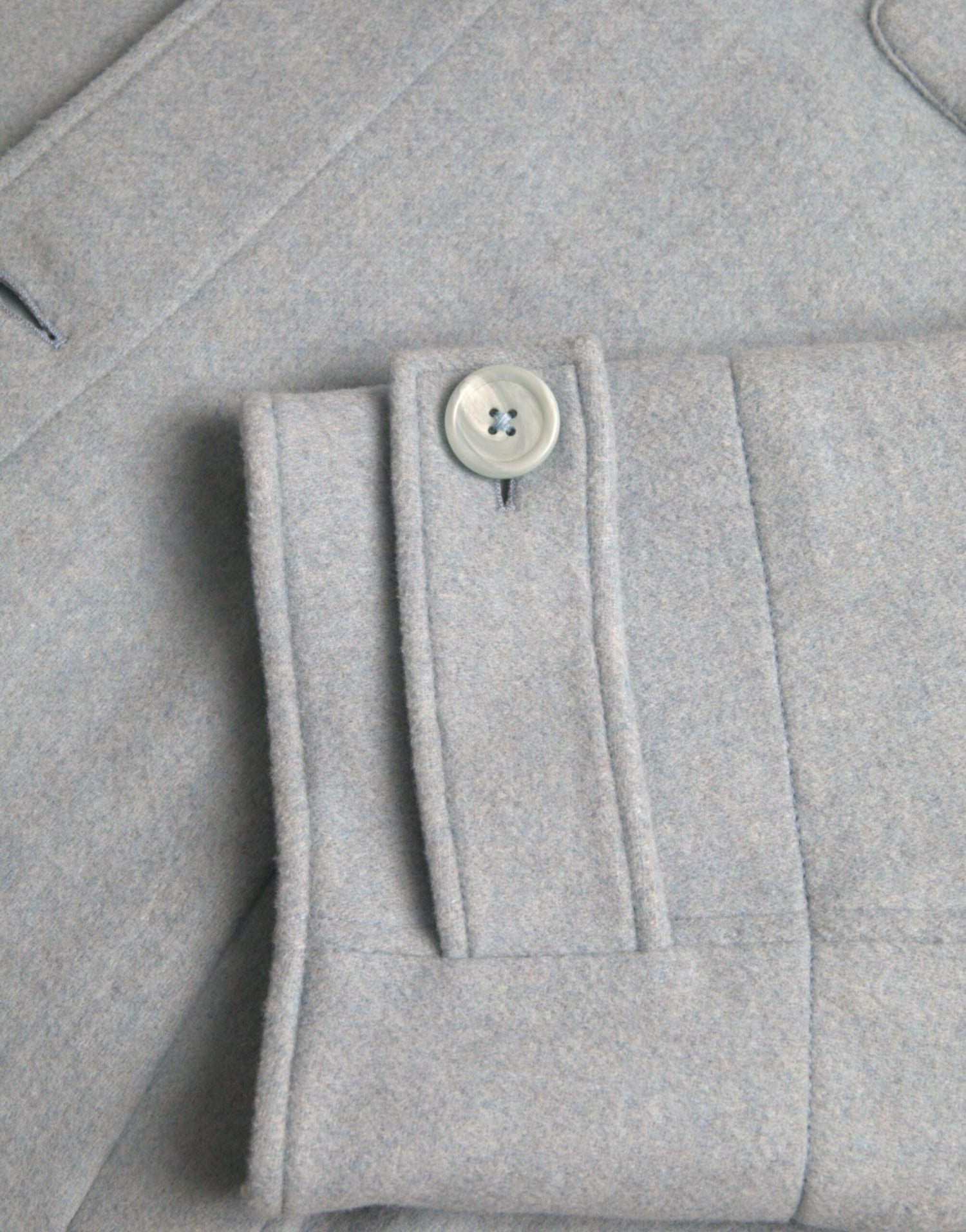 Dolce &amp;amp; Gabbana ljusblå ulltrenchcoat med knappar