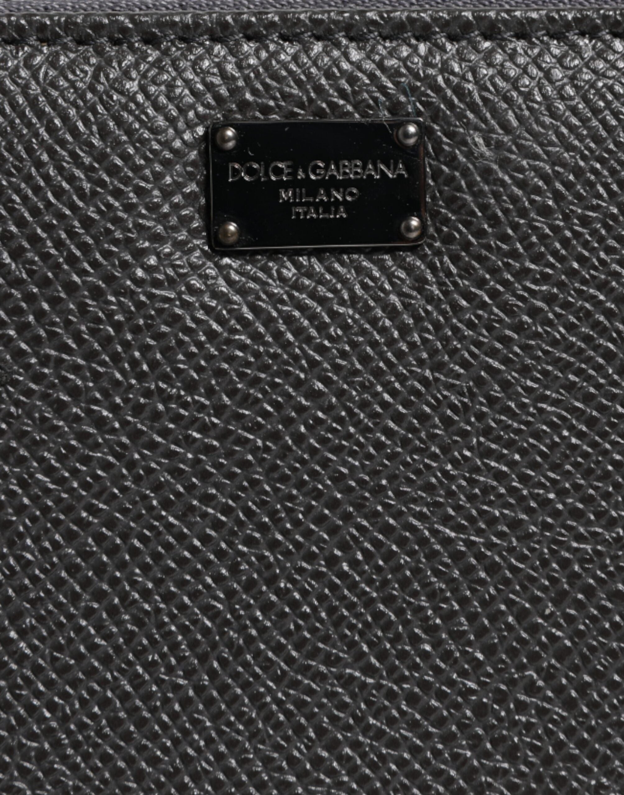 Dolce &amp;amp; Gabbana mörkgrå läderplånbok med DG-logotyp och dragkedja runtom
