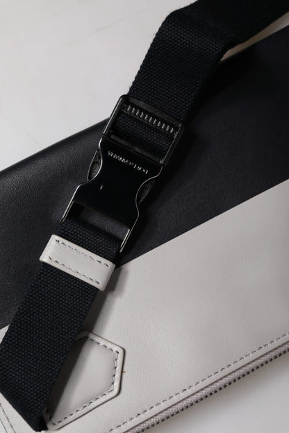 Dolce &amp;amp; Gabbana svartvit läderaxelväska med präglad logotyp